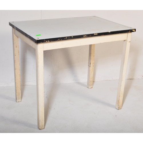 557 - A vintage retro mid 20th century circa. 1950's kitchen table with white enamelled table top over squ... 