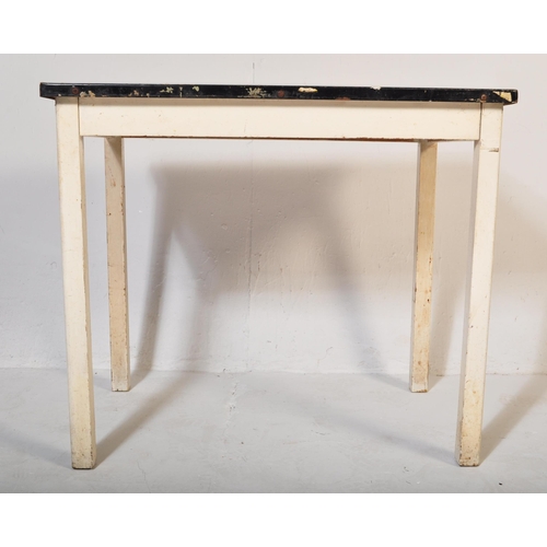 557 - A vintage retro mid 20th century circa. 1950's kitchen table with white enamelled table top over squ... 
