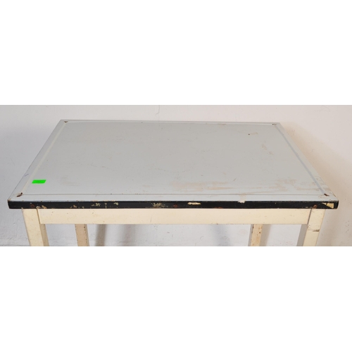 557 - A vintage retro mid 20th century circa. 1950's kitchen table with white enamelled table top over squ... 