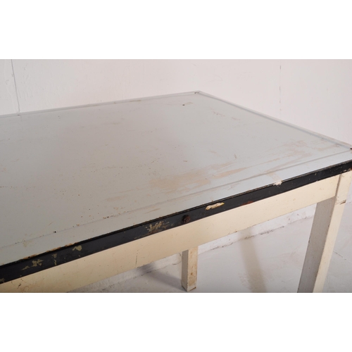 557 - A vintage retro mid 20th century circa. 1950's kitchen table with white enamelled table top over squ... 