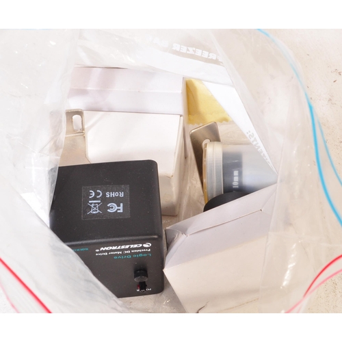 558 - A Celestron AstroMaster 130 telescope on tripod stand together with accessories & motors. Box not in... 