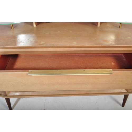 559 - A retro vintage mid 20th Century oak dressing table having a mirror to back with twin suspension set... 