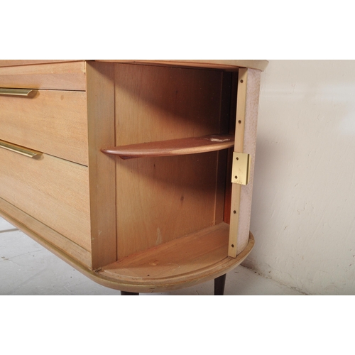 559 - A retro vintage mid 20th Century oak dressing table having a mirror to back with twin suspension set... 