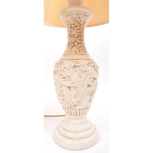 566 - A pair of vintage 20th Century table desk lamp lights. One having a white resin carved dragon taperi... 