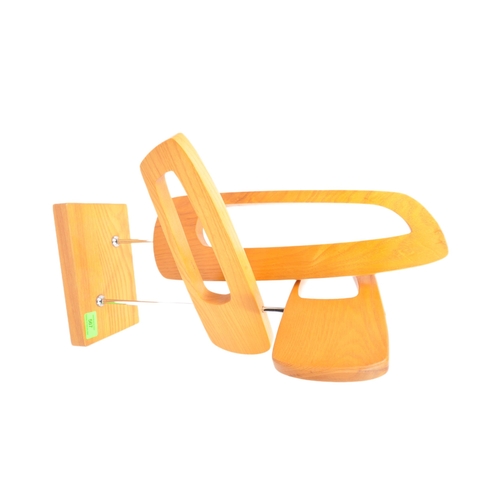 567 - A contemporary wooden abstract table top sculpture. The sculpture being made of three pierced concep... 