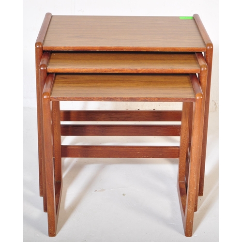 573 - A vintage retro mid 20th century circa. 1960's nest of tables having teak wood supports resembling G... 