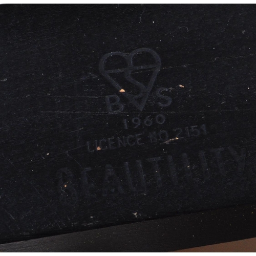 575 - A retro vintage mid 20th Century teak wood extending dining table with four chairs. The table having... 