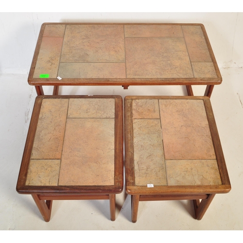 578 - A mid 20th Century retro vintage tile top nest of tables. Of rectangular form with two other tile to... 