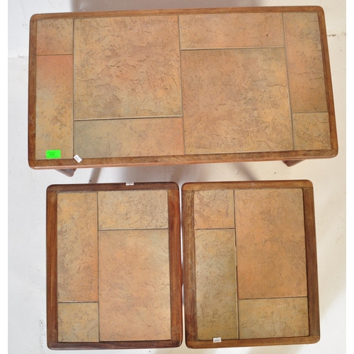 578 - A mid 20th Century retro vintage tile top nest of tables. Of rectangular form with two other tile to... 