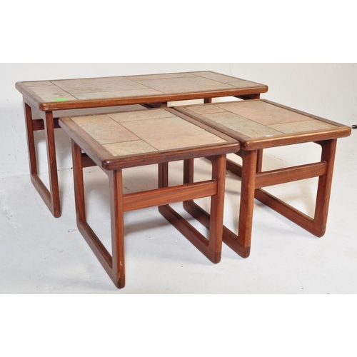 578 - A mid 20th Century retro vintage tile top nest of tables. Of rectangular form with two other tile to... 