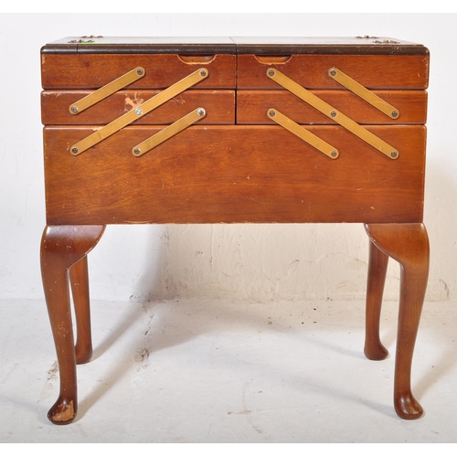 583 - Mid century beech wood sewing box. Of large form being raised on cabriole legs with pad feet support... 