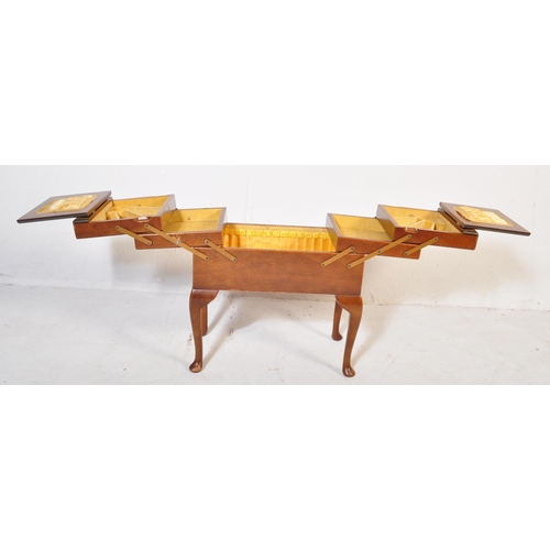 583 - Mid century beech wood sewing box. Of large form being raised on cabriole legs with pad feet support... 