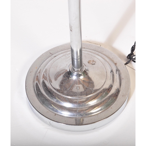 591 - A contemporary floor standing standard lamp light. Having a white netted shade, with a chrome tubula... 