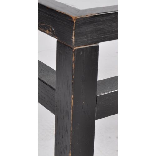 612 - A large late 20th Century dark veneered coffee table / low table having an inset clear glass top wit... 