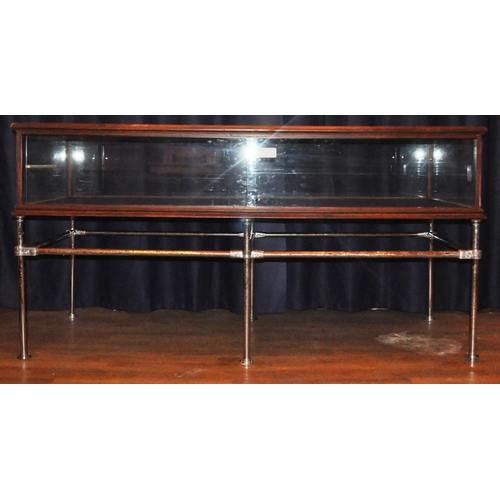 635 - A large 20th Century stained pine framed and glass paneled shop display cabinet / counter of large r... 