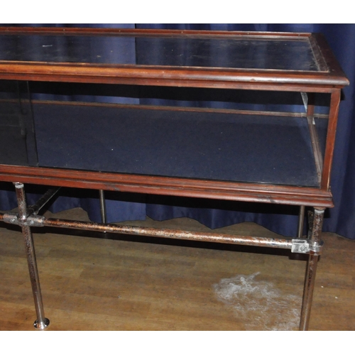 635 - A large 20th Century stained pine framed and glass paneled shop display cabinet / counter of large r... 