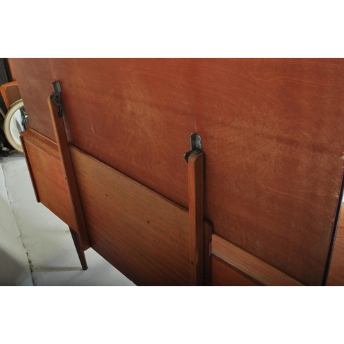 643 - Austinsuite - Mid-century teak wood dressing table being raised on splayed legs with suspended body ... 