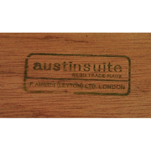 645 - Mid century teak wood dressing table being raised on splayed legs with suspended body of four deep d... 