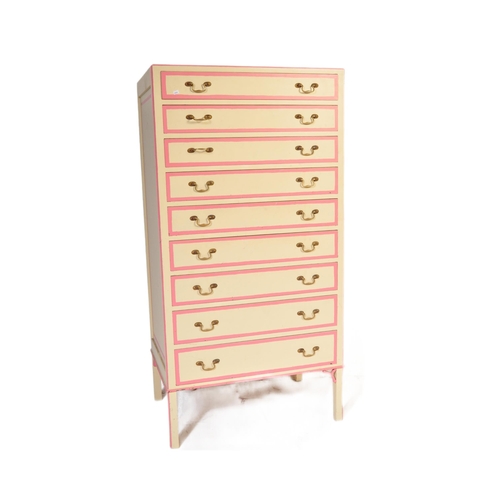 646 - A retro vintage 20th century wooden painted tall chest of drawers. The tallboy having a series of ni... 