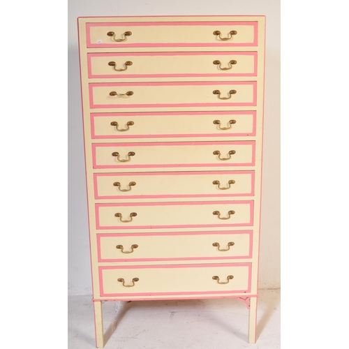 646 - A retro vintage 20th century wooden painted tall chest of drawers. The tallboy having a series of ni... 