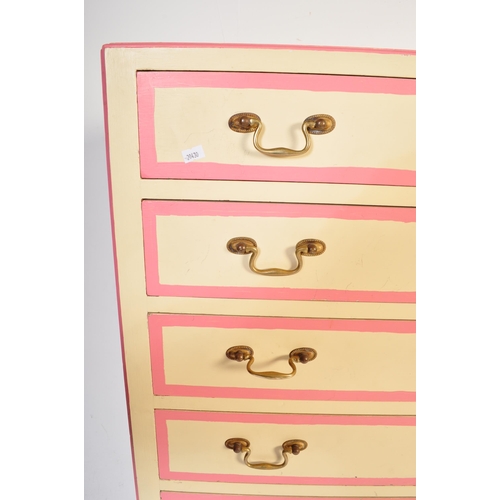 646 - A retro vintage 20th century wooden painted tall chest of drawers. The tallboy having a series of ni... 