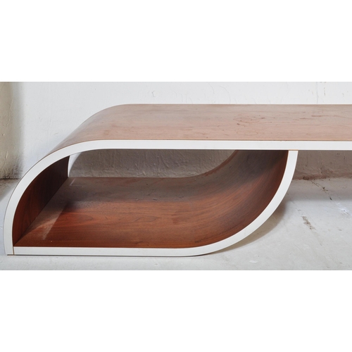 652 - A contemporary low bentwood coffee table / console table along with a bentwood desk chair raised on ... 