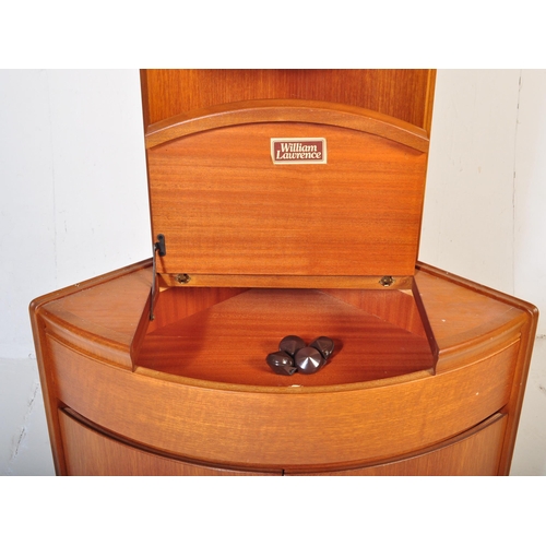 656 - William Lawrence - A retro mid 20th Century teak corner cabinet having a slender shelf top raised on... 