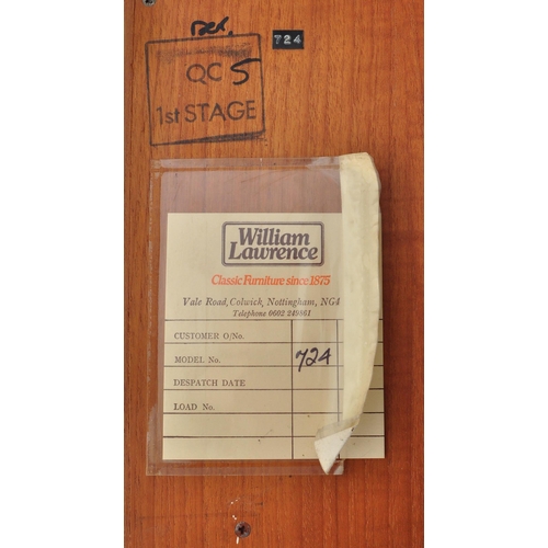 656 - William Lawrence - A retro mid 20th Century teak corner cabinet having a slender shelf top raised on... 