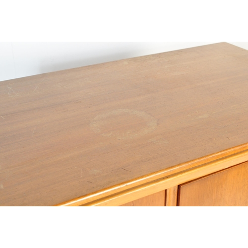 657 - A retro mid 20th Century walnut veneer childrens wardrobe / chest tallboy having a fall length wardr... 