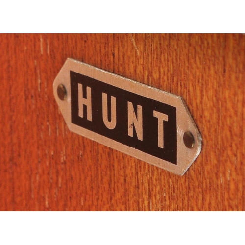 657 - A retro mid 20th Century walnut veneer childrens wardrobe / chest tallboy having a fall length wardr... 