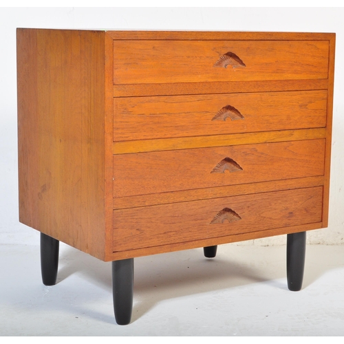 661 - A retro 20th Century small teak chest of drawers / bedside chest having four drawers each with carve... 
