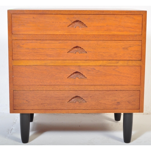 661 - A retro 20th Century small teak chest of drawers / bedside chest having four drawers each with carve... 