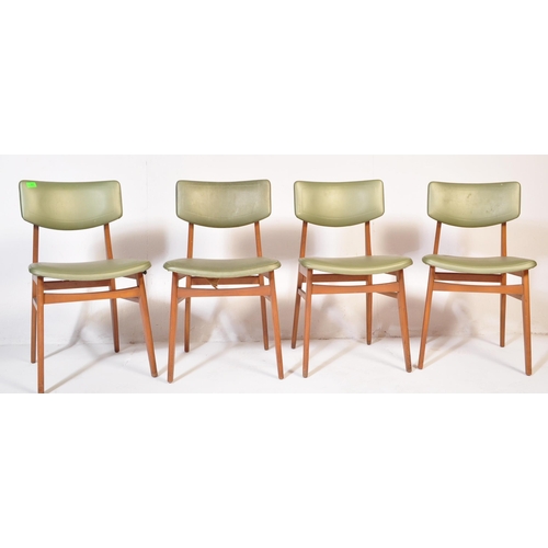 662 - A matching set of four retro mid 20th Century beech framed dining chairs each with faux green leathe... 