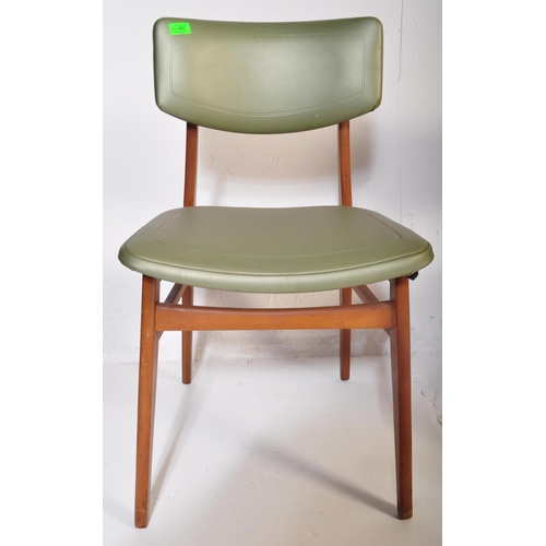 662 - A matching set of four retro mid 20th Century beech framed dining chairs each with faux green leathe... 