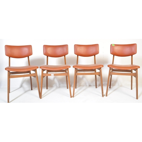 663 - A matching set of four retro mid 20th Century beech framed dining chairs each with faux burgundy lea... 