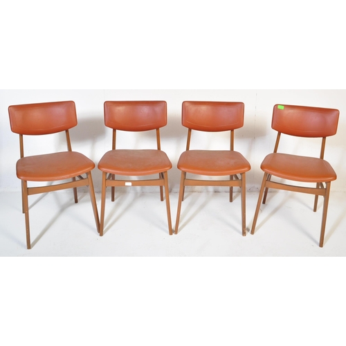 663 - A matching set of four retro mid 20th Century beech framed dining chairs each with faux burgundy lea... 