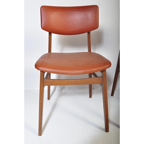 663 - A matching set of four retro mid 20th Century beech framed dining chairs each with faux burgundy lea... 
