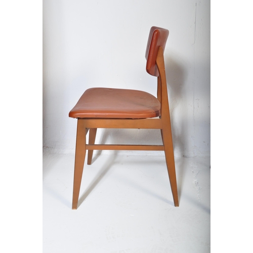 663 - A matching set of four retro mid 20th Century beech framed dining chairs each with faux burgundy lea... 