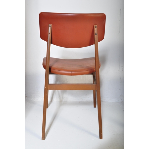663 - A matching set of four retro mid 20th Century beech framed dining chairs each with faux burgundy lea... 