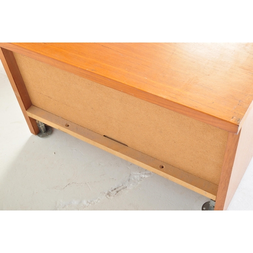 664 - A matching pair of retro teak bedside chests / nightstands with each of low form having single blind... 