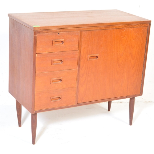 668 - A retro mid Century circa 1970s teak wood sewing table cabinet / desk combination having fold out ac... 