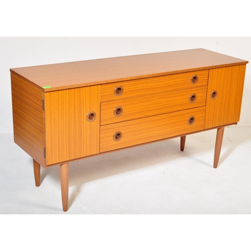 670 - A retro vintage mid 20th Century teak sideboard credenza by Schreiber. Bank of three drawers flanked... 