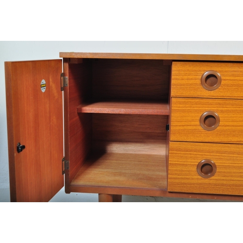 670 - A retro vintage mid 20th Century teak sideboard credenza by Schreiber. Bank of three drawers flanked... 