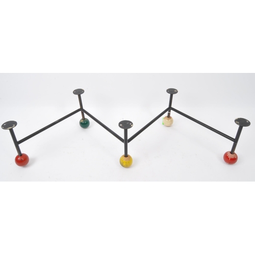 673 - A retro vintage mid 20th century circa. 1960's atomic style coat rack having ebonised wire metal fra... 
