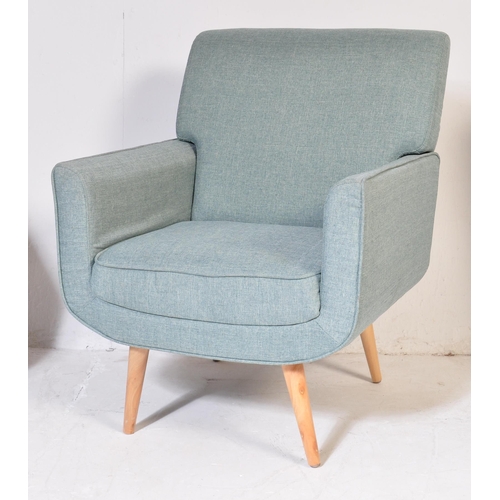 695 - Three contemporary light blue fabric padded back and seat rests lounge chairs raised on beech splaye... 
