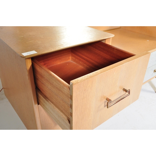 698 - A retro mid 20th Century light oak-ply dressing table chest in the manner of G Plan having a framele... 