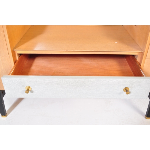 698 - A retro mid 20th Century light oak-ply dressing table chest in the manner of G Plan having a framele... 