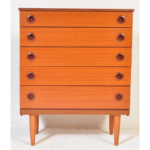 702 - A retro mid 20th century Danish inspired teak chest of drawers having a bank of five drawers each wi... 