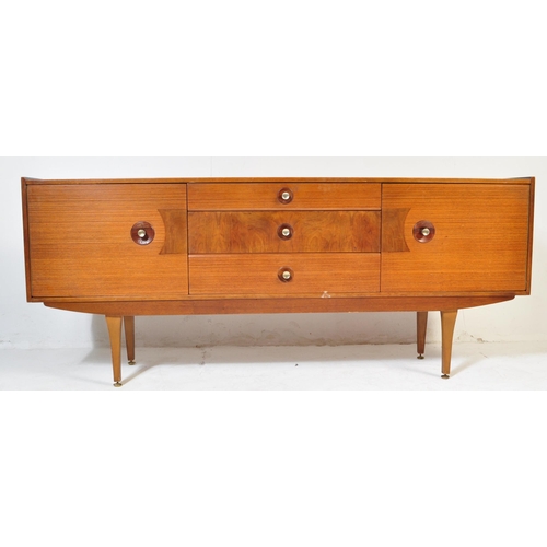 709 - A retro vintage 20th century circa 1970s Stone Hill sideboard. The sideboard having a central bank o... 