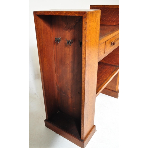 710 - An Art Deco early 20th century circa 1930s oak wood hall desk. The desk having a central top with si... 